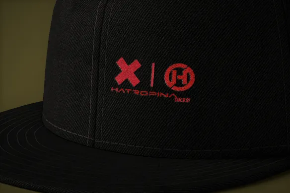 Hatropina Sucks snapback trucker visiera piatta nero